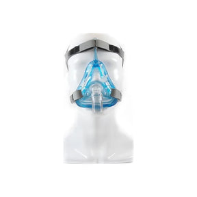 Full face CPAP mask with blue cushion and grey headgear on a white mannequin
