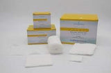 Sterile medical gauze pads and bandages with yellow-white packaging on a white surface