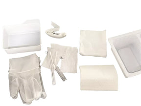Sterile medical dressing change kit with gloves, gauze, trays, and bandage supplies