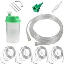 Oxygen humidifier bottle with green cap, tubing, connectors, and accessories for home medical use