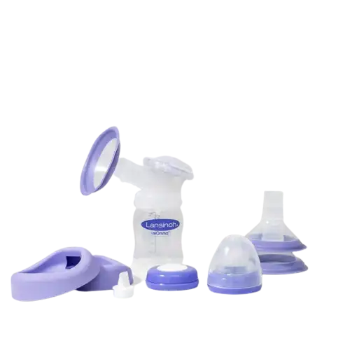 manual breast pump set with purple and white parts on white background
