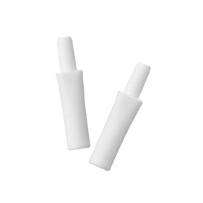 Pair of white medical adapter ends on plain background