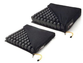 Two black air cell wheelchair cushions with removable covers for pressure relief