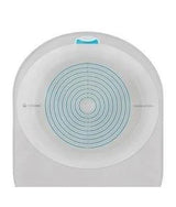 Adhesive ostomy barrier with concentric circles for precise fitting, used in stoma care