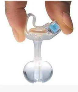 Hand holding medical gastrostomy feeding tube with balloon end for enteral nutrition