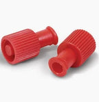 Two red medical luer lock caps for secure closure of syringes or IV lines on white background