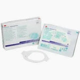Medical dressing kit with packaging and wound care supplies on a white background