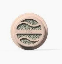 Round medical filter with beige plastic casing and porous center, home healthcare supply
