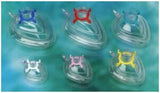 Set of transparent anesthesia masks with color-coded connectors on a green background