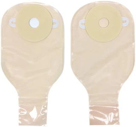 Two beige ostomy bags with adhesive seals for medical stoma care, displayed on a white background.