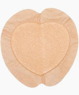 Heart-shaped transparent adhesive patch for medical use on a white background