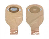 Two beige ostomy bags with adhesive flanges for medical use, displayed on a white background.