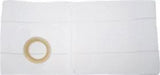 white medical ostomy barrier pad with adhesive ring for stoma care on plain background