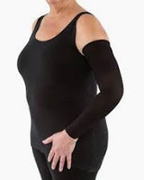 Woman wearing a black compression sleeve on her arm, demonstrating medical support wear