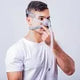 Man wearing a CPAP nasal mask for sleep apnea or respiratory support