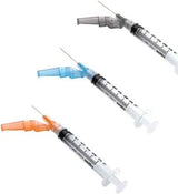 Three medical syringes with colored safety caps for home healthcare and medication delivery