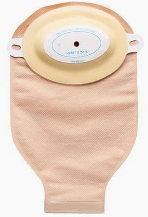 One-piece beige ostomy pouch with adhesive barrier, home medical supply on white background