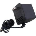 Black wall plug power adapter with attached cable for medical equipment