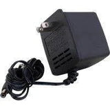 Black wall plug power adapter with attached cable for medical equipment