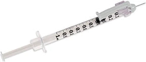 Sterile medical syringe with needle and clear measurement markings for home healthcare use