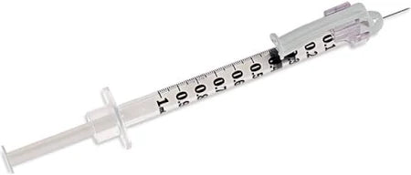 Sterile medical syringe with needle and clear measurement markings for home healthcare use