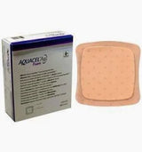 Aquacel Ag foam dressing box and a sterile wound care pad on white background