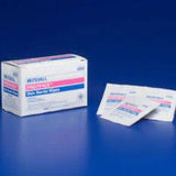 Box of individually wrapped sterile alcohol prep pads on a blue background