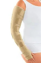 Woman wearing a beige medical arm compression sleeve for lymphedema support