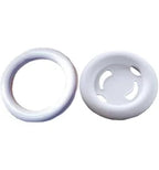 White silicone medical supply rings and disc on plain background