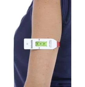 Adult arm with a medical MUAC measuring tape for nutrition or health monitoring
