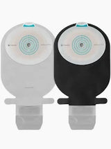 Two ostomy bags, one white and one black, with adhesive barriers for medical use