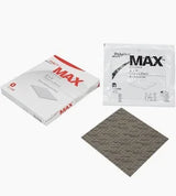 MAX absorbent medical dressing pads in packaging and one gray pad displayed