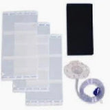 Essential medical supplies including transparent storage bags, a coiled tube, and a black rectangular pad on a white background.