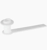 White plastic medical supply component with flat handle on plain background