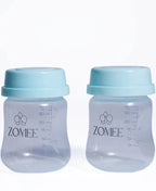 Two Zomee baby bottles with blue lids and measurement markings side by side