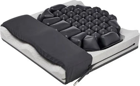 Medical air cushion seat with contoured foam and black inflatable cells for pressure relief.