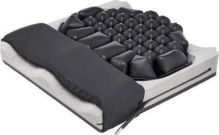 Medical air cushion seat with contoured foam and black inflatable cells for pressure relief.