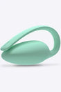 Light green ergonomic medical device with looped handle on white background