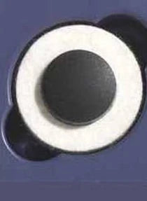 Close-up of a medical adhesive patch with a central black circular sensor on a blue background