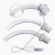 Three medical tracheostomy tubes and accessories on a white background