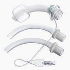Three medical tracheostomy tubes and accessories on a white background