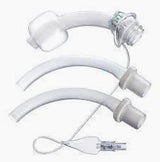 Three medical tracheostomy tubes and accessories on a white background