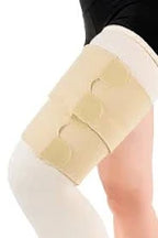 Close-up of medical leg bandage with adjustable straps on a person's thigh