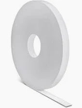 Large roll of white medical tape on a neutral background
