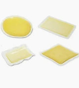 Assorted hydrocolloid wound dressings for chronic wound care on a white background
