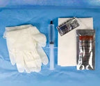 Medical supply kit with gloves, syringe, gauze, and packaged items on blue surface