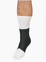 Ankle compression sleeve worn over a white sock on a person's foot
