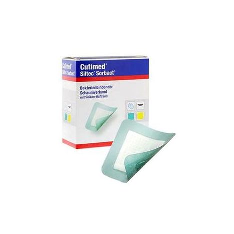 Box and foam wound dressing pad with green border for absorbent wound care