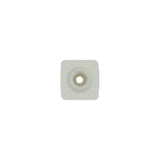 Square adhesive medical ostomy barrier with central opening on white background