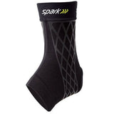 Black kinetic ankle sleeve with geometric pattern for support and compression